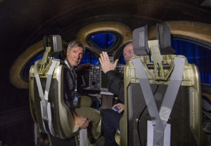 Actor and Pilot Harrison Ford listens to Virgin Galactic chief pilot Dave Mackay inside the new SS2.Virgin Spaceship Unity is unveiled in Mojave, California, Friday February 19th, 2016. VSS Unity is the first vehicle to be manufactured by The Spaceship Company, Virgin Galactic's wholly owned manufacturing arm, and is the second vehicle of its design ever constructed. VSS Unity was unveiled in FAITH (Final Assembly Integration Test Hangar), the Mojave-based home of manufacturing and testing for Virgin Galactic's human space flight program. VSS Unity featured a new silver and white livery and was guided into position by one of the company's support Range Rovers, provided by its exclusive automotive partner Land Rover...
